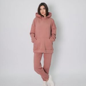 Woman wearing pink hoodie and sweatpants - Ink Fervor women's hoodie