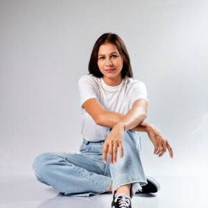 Studio photo of woman in white t-shirt and jeans - Ink Fervor tee